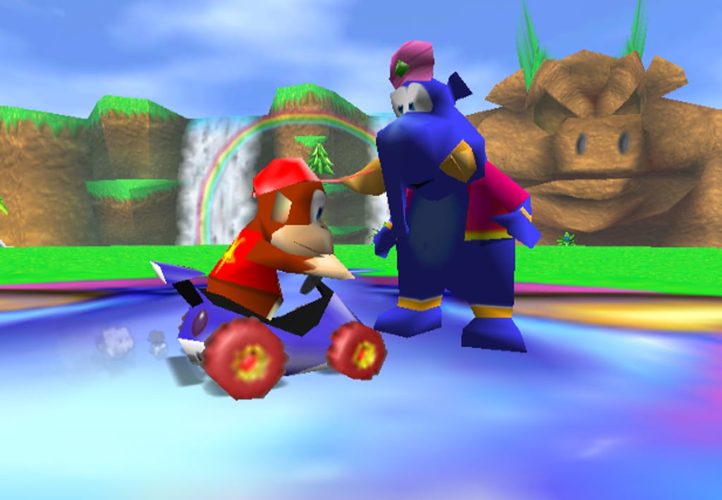 Diddy Kong møter en figur ved en foss i Diddy Kong Racing på Nintendo 64