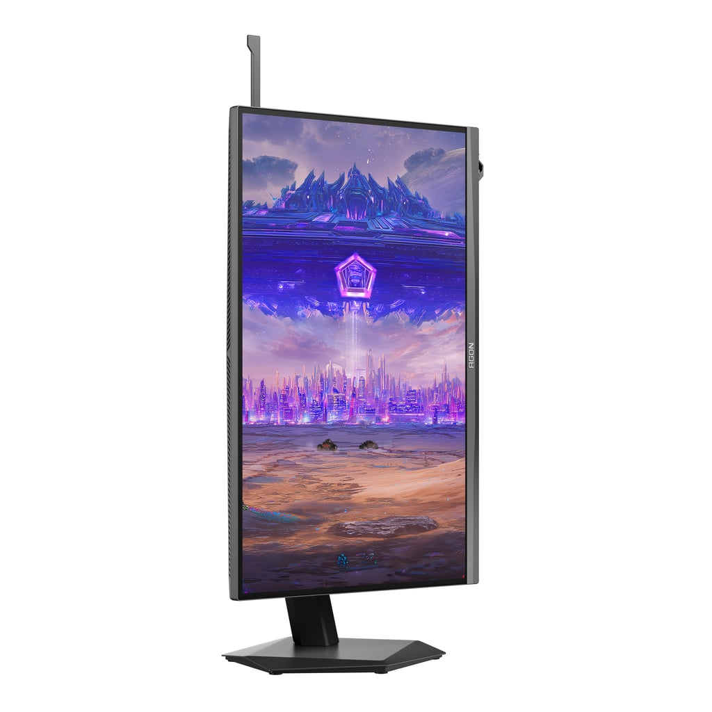 AOC AGON PRO AGP257FT dreid på høykant, med et fantasylandskap på skjermen