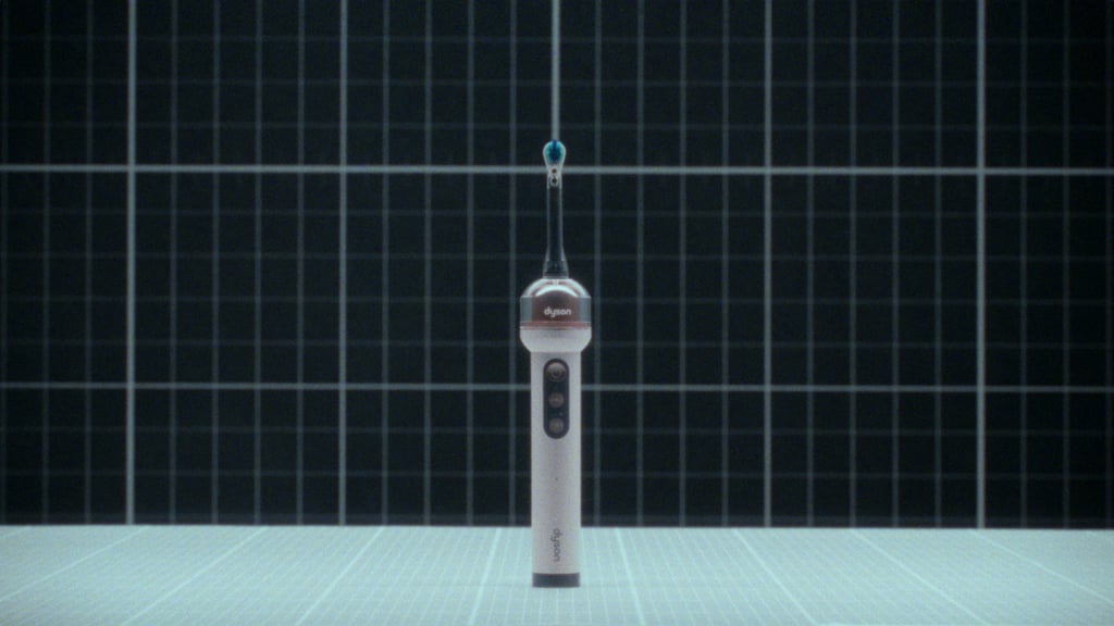 Dyson CameraJet elektrisk tannbørste stående på et rutenett