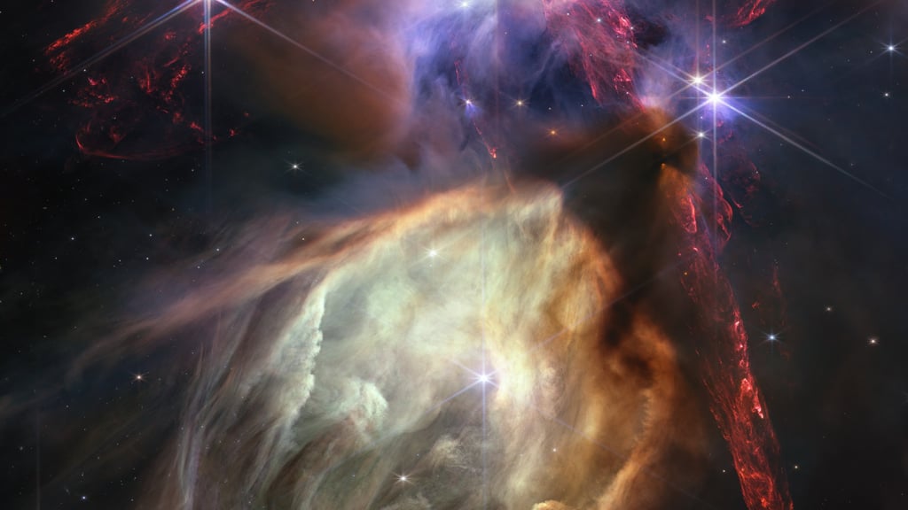 Stjernefabrikken Rho Ophiuchi i røde og gyldne gass-skyer, fotografert av James Webb-teleskopet