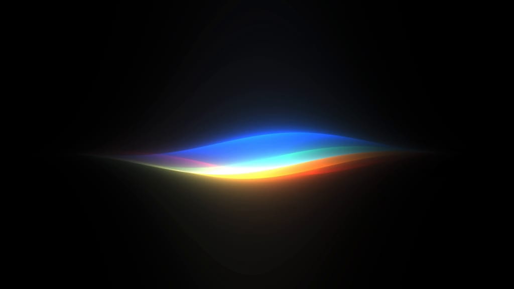 Siri AI-gløden i regnbuefarger mot svart bakgrunn