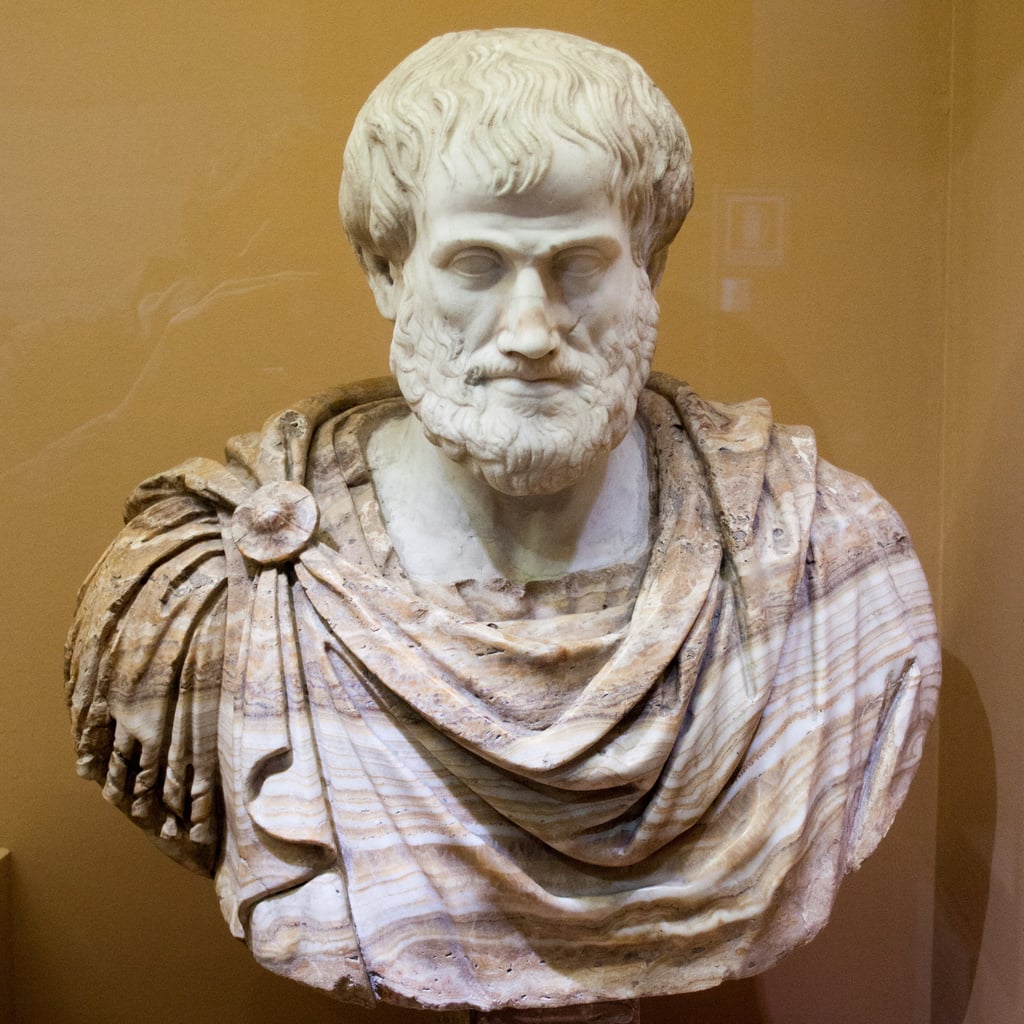 Marmorbyste av Aristoteles med krøllete skjegg og draperte klær